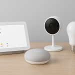 A collection of modern smart devices on a sleek table setup representing connected living